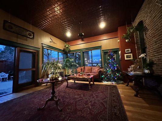 Sitting room with coffee, tea, water and board games, also leads to a quant back patio.