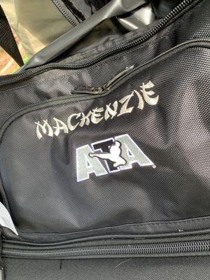 Another amazing job adding Mackenzie's name to her karate gear bag!