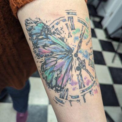 Healed photo of a custom watercolor butterfly tattoo