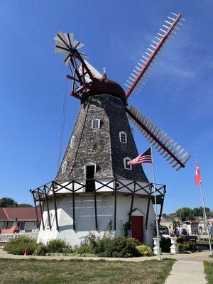 The back of windmill that you can take tours of.