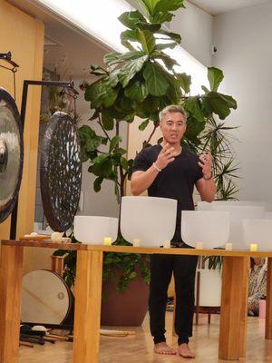 Kyle Lam explaining to the beginners the benefits of attending a Soundbath.