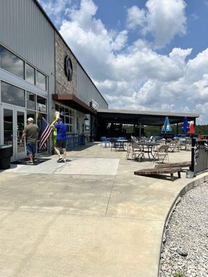 Entrance to the right side of the facility and it's outside patio