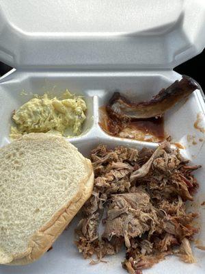 Pulled pork, potato salad, and a rib