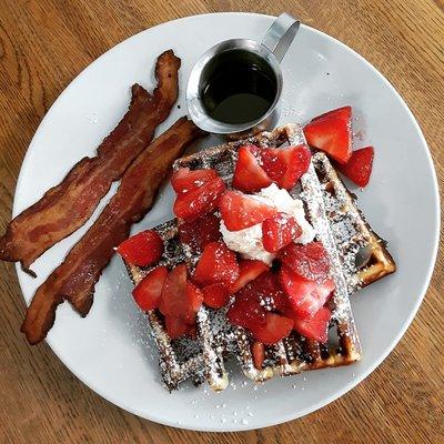 Come and enjoy one of our hot, fresh, and delicious waffles topped with fresh fruit and powdered sugar!