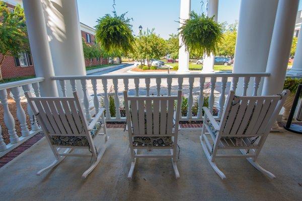 Covered Patio with Rocking Chairs at The Manor