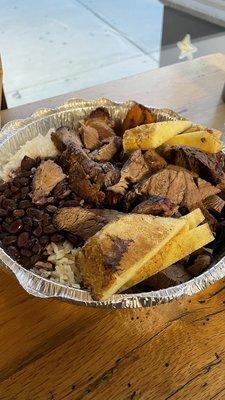 Steak, pineapple, rice and beans.