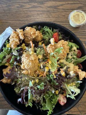 Breaded chicken nuggets on Fresh salad