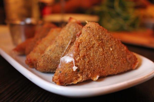 Golden fried mozzarella triangles.