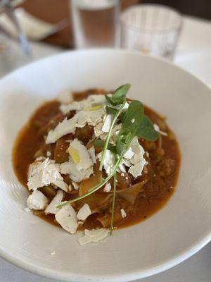 25 PAPPARDELLE PREZZEMOLATE Slow braised pork in Pinot Grigio, poricini and ricotta salata in a San Marzano tomato sauce