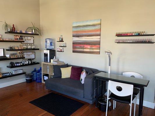 Lounge area and manicure table at Aura Spa