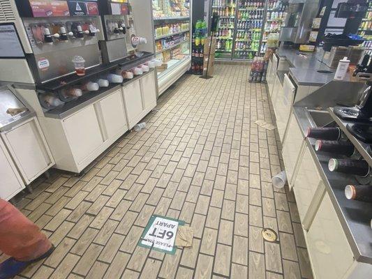 Cups on ground  Cup with soda laying on the soda fountain