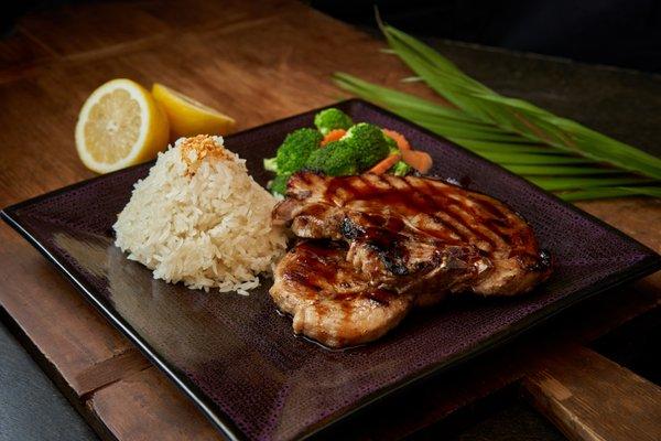 E-sarn Pork Chop
 Grilled marinated pork chop Thai style served w/ steam mixed veggie and sticky rice.