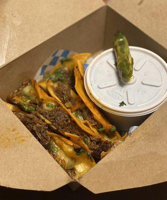 birria tacos, consomé in the side container