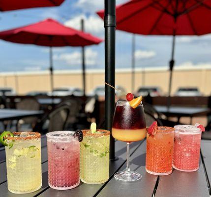 Line up of our hand muddled fruit margaritas!