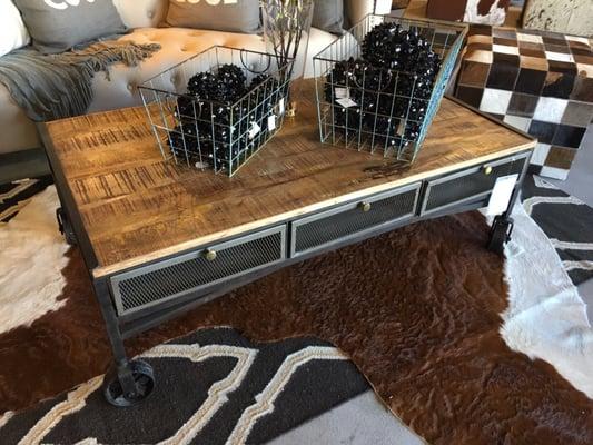 Beautiful industrial like coffee table we were thinking of getting. Love the vintage couch behind it too!