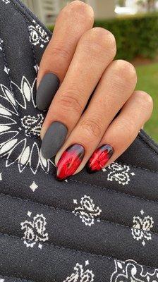 Red flowers and black mate nails