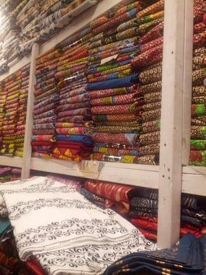 Some shelved fabrics at AKN Fabrics. Mostly Vlisco.