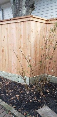 Red cedar pickets with treated pine posts and bottom board.