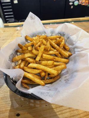 Basket of hot crispy fries .