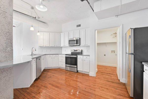 Modern kitchen with stainless steel appliances at South Side on Lamar