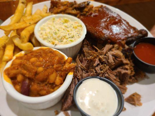 Smokehouse Sampler. All the goods. Even the beans are meatalicious.  2 BBQ sauces, coleslaw, choice of starch. A must.