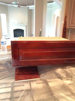 Custom kitchen cabinets refinish to match this wood floors