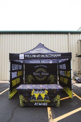 Custom designed tent with walls and custom table cover.