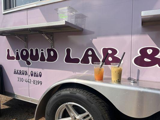 Liquid Lab & Studio trailer with a peachy keen fruit tea & mango milk tea