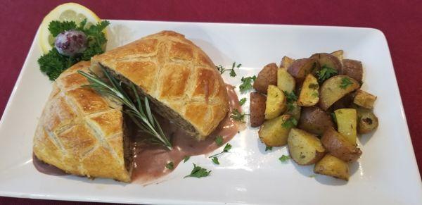 Beef Wellington with Herb roasted potatoes.