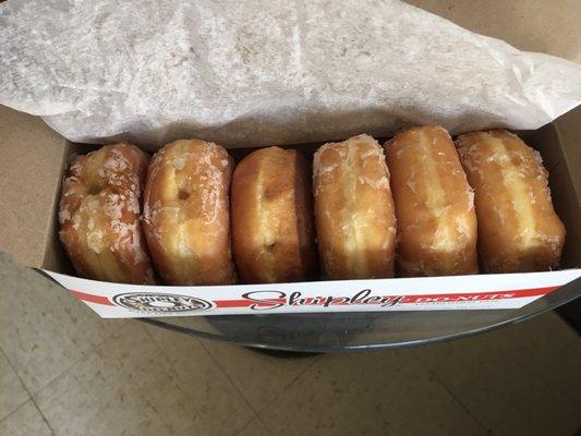 Half a dozen donuts: glazed, Boston cream, lemon and Bavarian