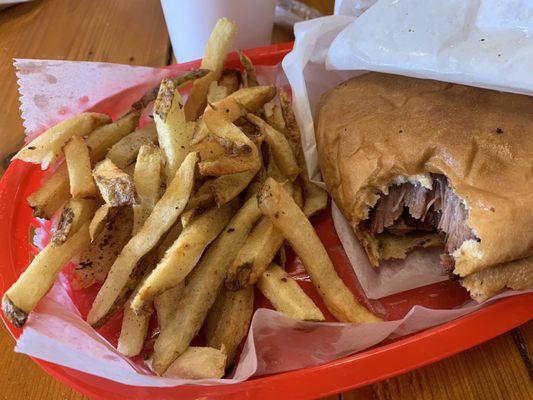 Sliced beef brisket and fries