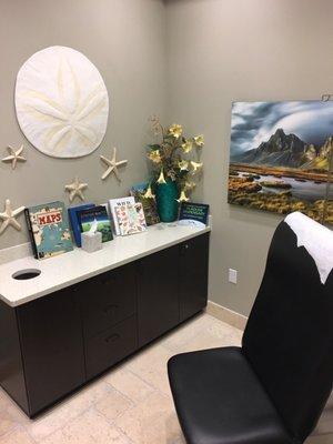 Beautiful and clean exam rooms. You can sit on the bench as a patient as well.