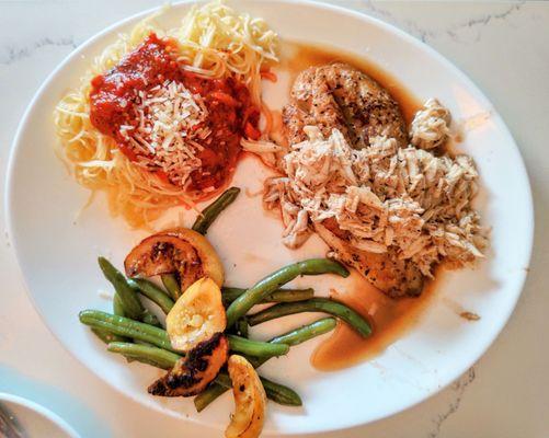 Fish topped with lump crab meat + pasta & veggies