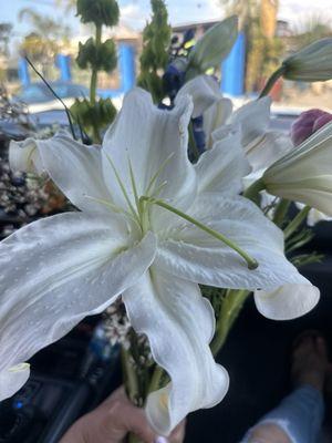 Beautiful arrangement of lilies and wildflowers