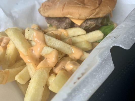 Single patty burger with American cheese, mustard, onion, lettuce, tomato and pickles....Side of fries with that amazing BHG sauce