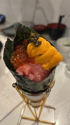 hand roll with uni, caviar, salmon roe, and otoro