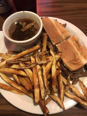 Prime rib sandwich with handmade fries and au jus