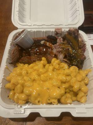 Two meat plate. Mac and cheese, brisket and pulled pork. Greens