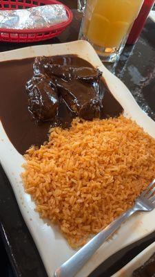 Mole Negro covered chicken with rice