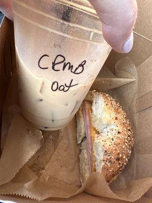 Crème brûlée latte with oat milk, ham and cheese bagel with hummus