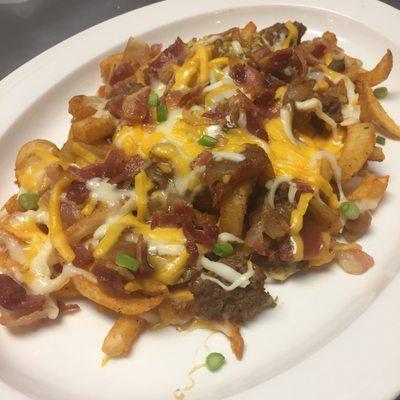 Twister Fries smothered in cheese, bacon and chili