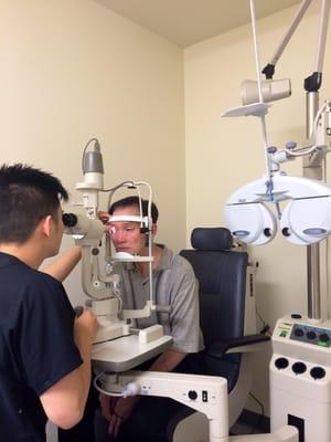 Dr. Tran conducting a comprehensive diabetic eye exam