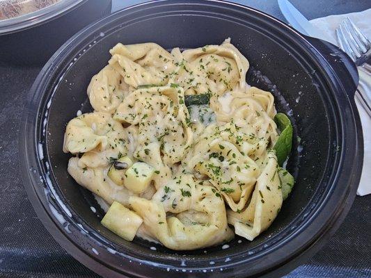 limited time chicken and prosciutto filled tortelloni in gouda sauce