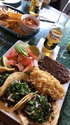 Steak tacos, with rice, beans and salad