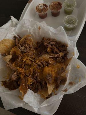 Apparently iCarne Asada Nachos. Too dry,, plain, not what I expected.FYI only sharing my opinion. Not trying to be rude