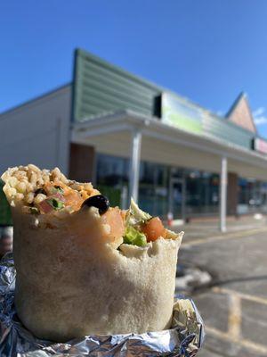 Burrito with carnitas and black bean filling.