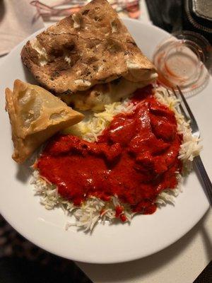 Naan, butter chicken, samosas and rice