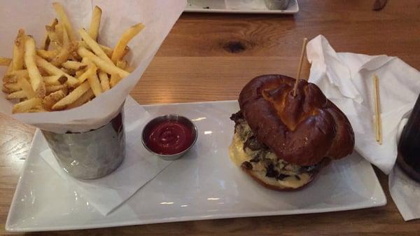 Parmesan fries with PhiliSteak burger on a pretzel roll.