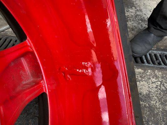 Said they would replace my new powdered coat rim and new tire but just welded it.....and used regular off red paint to "fix" it