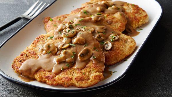 German Schnitzel with Mushroom Gravy, also known an Jaegerschnitzel